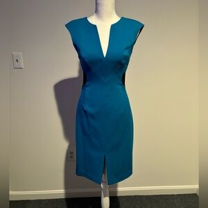 Black Halo pencil dress in blue with black cutouts